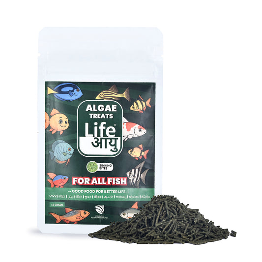 Algae treats packaging with fish illustrations and a pile of black algae beads on a white background